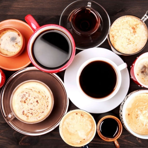 Top view of many different kinds of cups of coffee